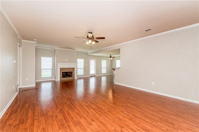 524 Jessica Way, Covington, LA 70435 - unfurnished living room featuring a ceiling fan, light wood finished floors, baseboards, a premium fireplace, and ornamental molding