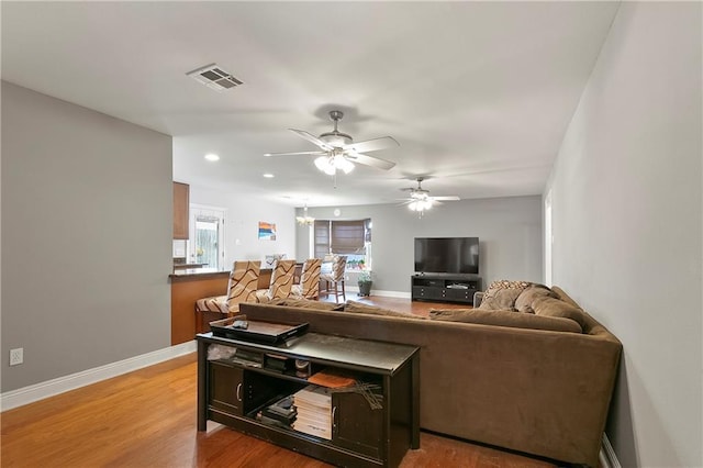 3416 Dauterive Dr, Chalmette, LA 70043 - living room featuring light wood finished floors, baseboards, a ceiling fan, and visible vents