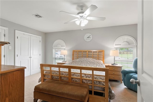 3416 Dauterive Dr, Chalmette, LA 70043 - bedroom with light carpet, visible vents, a closet, and a ceiling fan