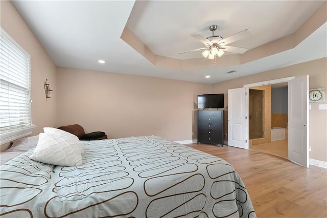 3416 Dauterive Dr, Chalmette, LA 70043 - bedroom with a raised ceiling, light wood finished floors, visible vents, and recessed lighting