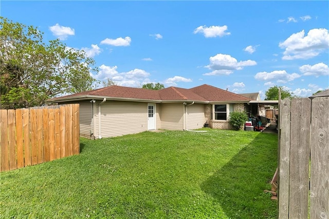 3416 Dauterive Dr, Chalmette, LA 70043 - rear view of property with roof with shingles, a yard, fence, and brick siding