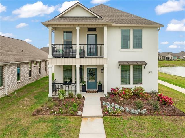 405 Short Bough Ln, Slidell, LA 70461 - view of front of house with a balcony, covered porch, and stucco siding