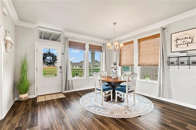 405 Short Bough Ln, Slidell, LA 70461 - dining area with a chandelier, wood finished floors, and crown molding