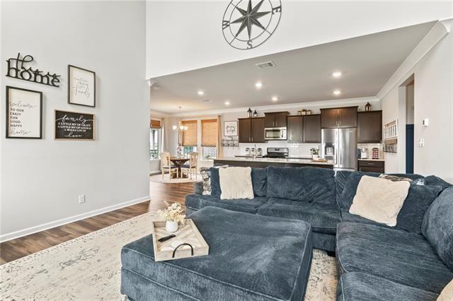 405 Short Bough Ln, Slidell, LA 70461 - living room featuring dark wood-type flooring, recessed lighting, and ornamental molding