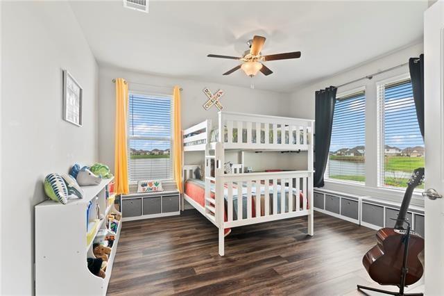 405 Short Bough Ln, Slidell, LA 70461 - bedroom with wood finished floors and a ceiling fan