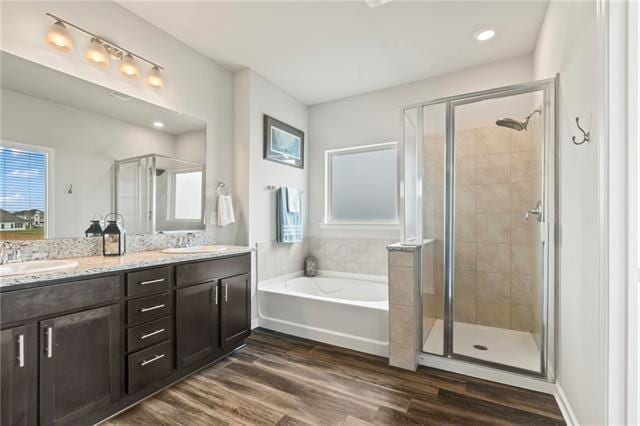 405 Short Bough Ln, Slidell, LA 70461 - full bath with a shower stall, a bath, double vanity, wood finished floors, and recessed lighting