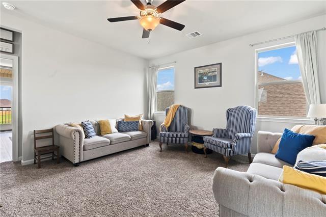 405 Short Bough Ln, Slidell, LA 70461 - carpeted living area featuring a ceiling fan