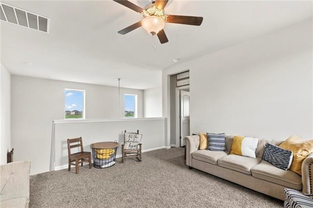 405 Short Bough Ln, Slidell, LA 70461 - carpeted living area featuring a ceiling fan and baseboards
