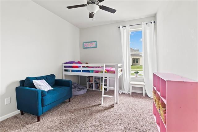 405 Short Bough Ln, Slidell, LA 70461 - carpeted bedroom with ceiling fan and baseboards