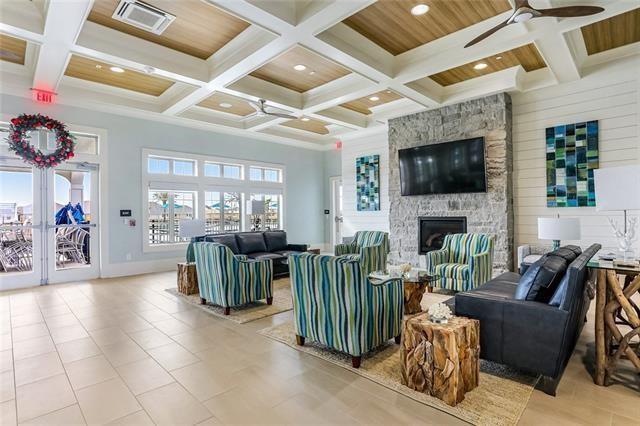 405 Short Bough Ln, Slidell, LA 70461 - living area featuring coffered ceiling, ceiling fan, a stone fireplace, beam ceiling, and recessed lighting