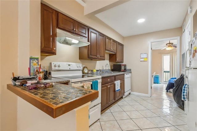 1020 Saint Julien Dr Unit 226, Kenner, LA 70065 - kitchen featuring white appliances, under cabinet range hood, light tile patterned floors, a ceiling fan, and recessed lighting