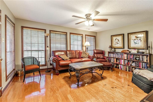 706 Natalie Dr, Houma, LA 70364 - living area with baseboards, a textured ceiling, wood finished floors, and a ceiling fan