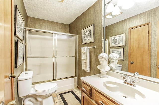 706 Natalie Dr, Houma, LA 70364 - bathroom with wallpapered walls, toilet, vanity, and a textured ceiling