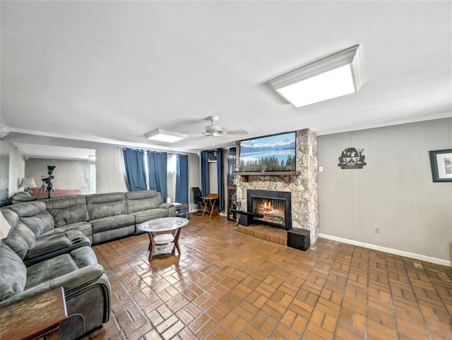 632 Fairlawn Dr, Terrytown, LA 70056 - living area featuring a ceiling fan, brick floor, baseboards, and a fireplace
