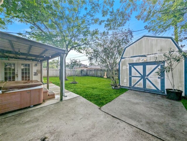 632 Fairlawn Dr, Terrytown, LA 70056 - view of yard with a patio area, french doors, an outdoor structure, a storage shed, and a fenced backyard