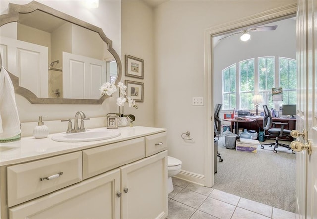 bathroom with toilet, tile patterned floors, and vanity