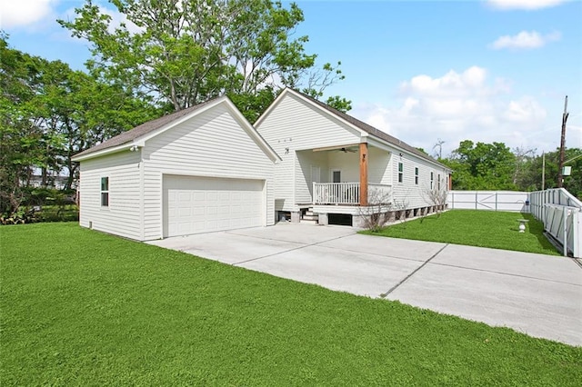 441 Hancock St, Gretna, LA 70053 - view of front of home featuring a garage, a front yard, fence, and a ceiling fan