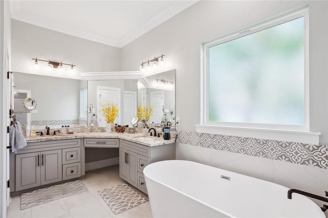 441 Hancock St, Gretna, LA 70053 - full bathroom with a soaking tub, double vanity, a sink, and ornamental molding