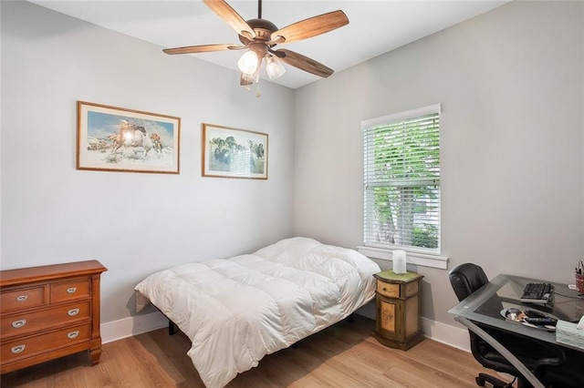 441 Hancock St, Gretna, LA 70053 - bedroom featuring baseboards, light wood-style flooring, and a ceiling fan