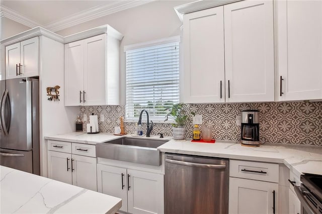441 Hancock St, Gretna, LA 70053 - kitchen with white cabinetry, tasteful backsplash, crown molding, stainless steel appliances, and a sink