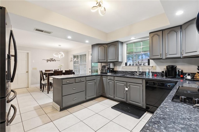 1100 Vintage Dr, Kenner, LA 70065 - kitchen featuring gray cabinets, a sink, a peninsula, visible vents, and black appliances
