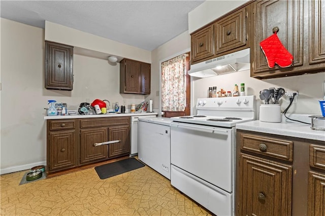 2900 Harvard Ave, Metairie, LA 70006 - kitchen featuring white electric range oven, under cabinet range hood, and light countertops