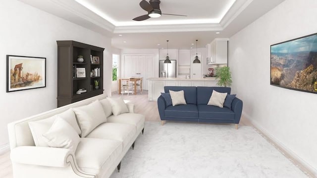 4412 Park Shore Dr, Marrero, LA 70072 - living room with ceiling fan, a raised ceiling, and baseboards