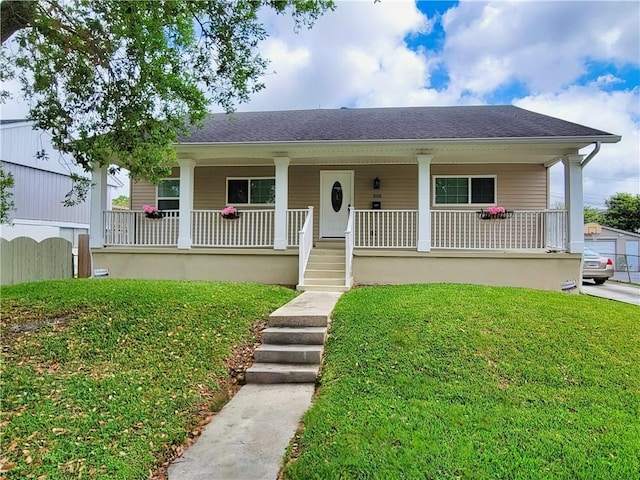 305 Amapola Cir, Terrytown, LA 70056 - bungalow-style home featuring covered porch, a front lawn, and a shingled roof