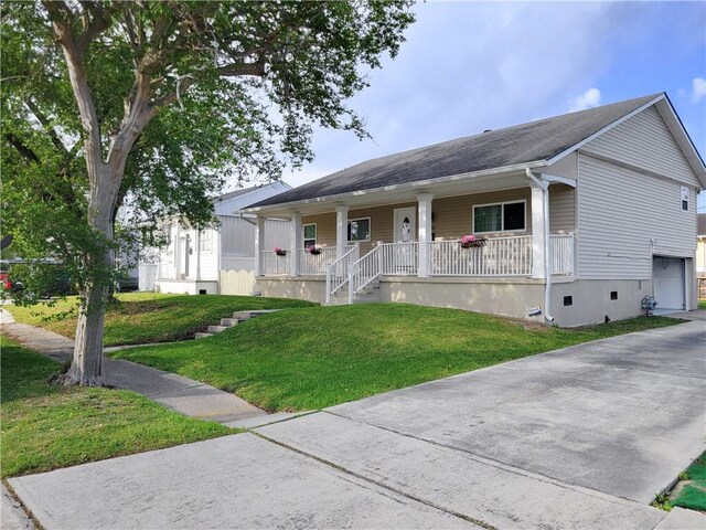 305 Amapola Cir, Terrytown, LA 70056 - ranch-style house with a porch, a front yard, roof with shingles, and an attached garage