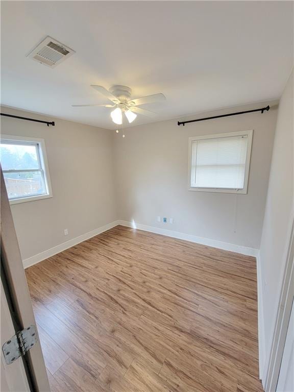305 Amapola Cir, Terrytown, LA 70056 - empty room with wood finished floors, a ceiling fan, and baseboards