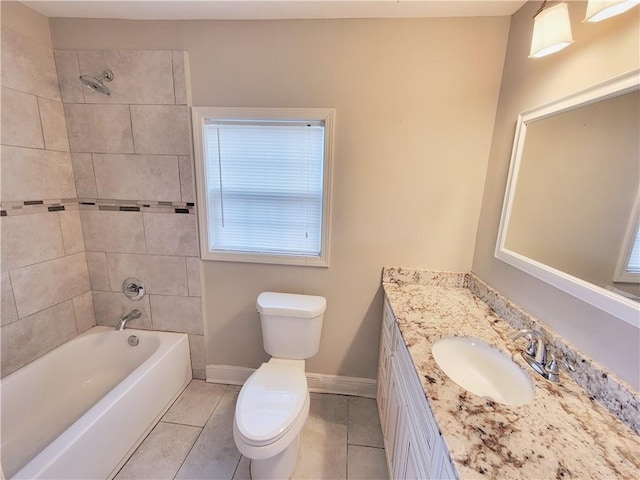 full bathroom featuring vanity, toilet, baseboards, bathtub / shower combination, and tile patterned floors