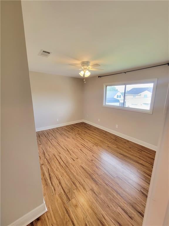 305 Amapola Cir, Terrytown, LA 70056 - spare room featuring light wood finished floors, baseboards, and a ceiling fan