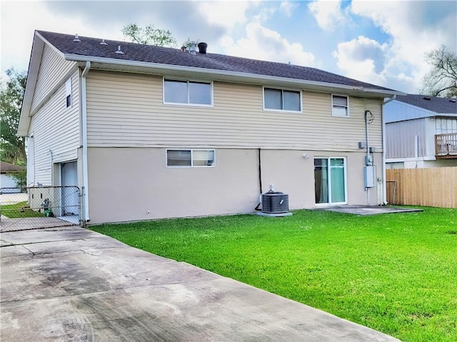 305 Amapola Cir, Terrytown, LA 70056 - rear view of house featuring cooling unit, an attached garage, driveway, and stucco siding