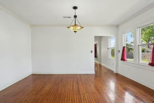 4674 Venus St, New Orleans, LA 70122 - empty room with crown molding and hardwood / wood-style floors