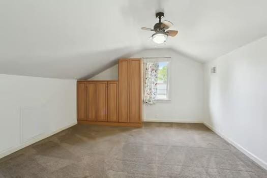 4674 Venus St, New Orleans, LA 70122 - additional living space with lofted ceiling, light colored carpet, and ceiling fan
