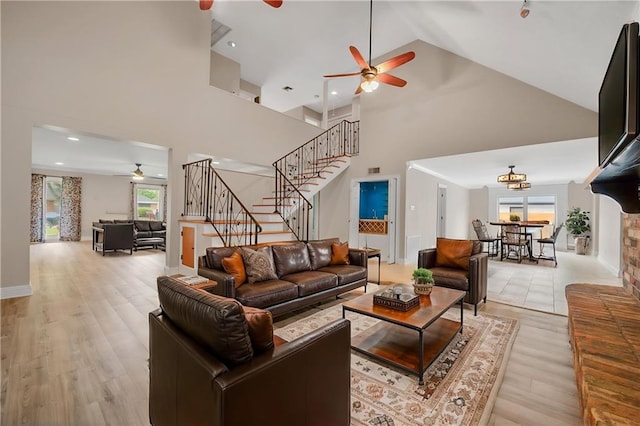 212 Somerset St, La Place, LA 70068 - living room with ceiling fan, stairs, high vaulted ceiling, plenty of natural light, and light wood finished floors