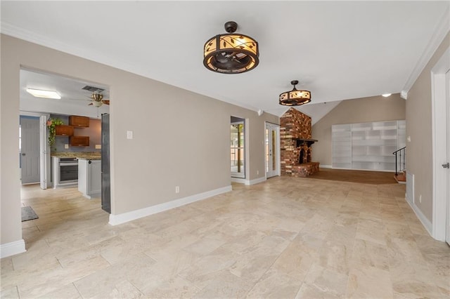 unfurnished living room featuring crown molding, visible vents, ceiling fan, and baseboards