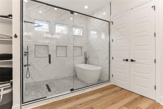 185 Boutte Estates Dr, Boutte, LA 70039 - full bath with a soaking tub, recessed lighting, a marble finish shower, and wood finished floors
