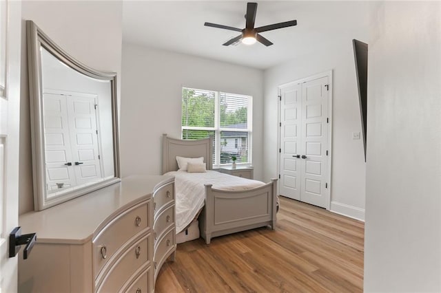 185 Boutte Estates Dr, Boutte, LA 70039 - bedroom featuring light wood-style flooring, baseboards, and ceiling fan