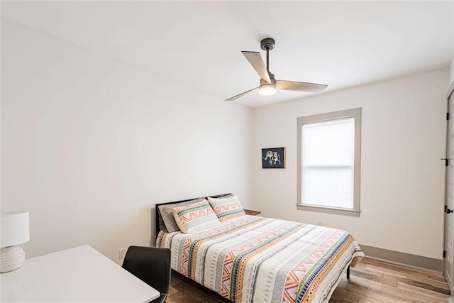 41820 S Genois St, New Orleans, LA 70119 - bedroom featuring ceiling fan and wood finished floors