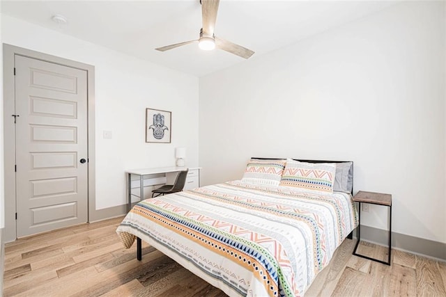 41820 S Genois St, New Orleans, LA 70119 - bedroom featuring wood finished floors, baseboards, and a ceiling fan