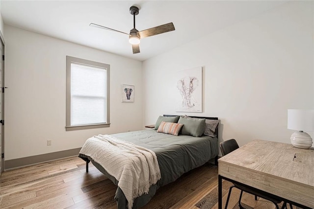 41820 S Genois St, New Orleans, LA 70119 - bedroom with baseboards, a ceiling fan, and wood finished floors