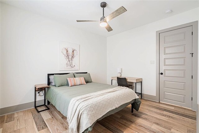 41820 S Genois St, New Orleans, LA 70119 - bedroom featuring light wood finished floors, baseboards, and a ceiling fan