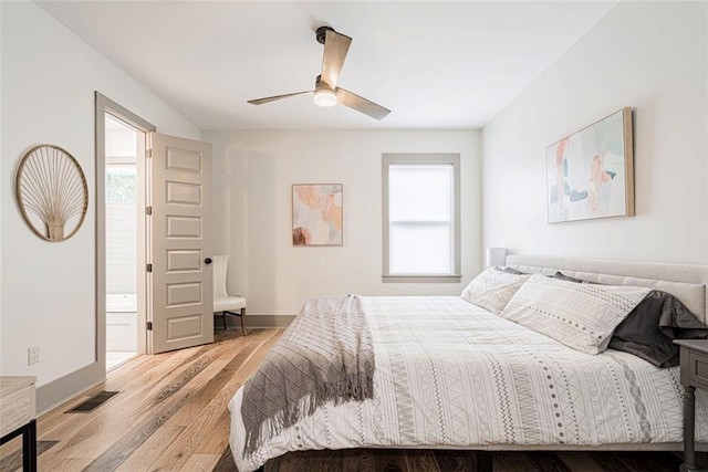 41820 S Genois St, New Orleans, LA 70119 - bedroom with wood finished floors, baseboards, multiple windows, and visible vents