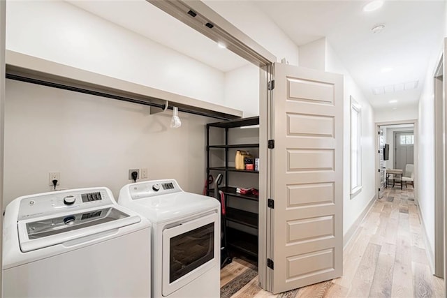 41820 S Genois St, New Orleans, LA 70119 - laundry area with washing machine and dryer, laundry area, visible vents, and light wood-style flooring