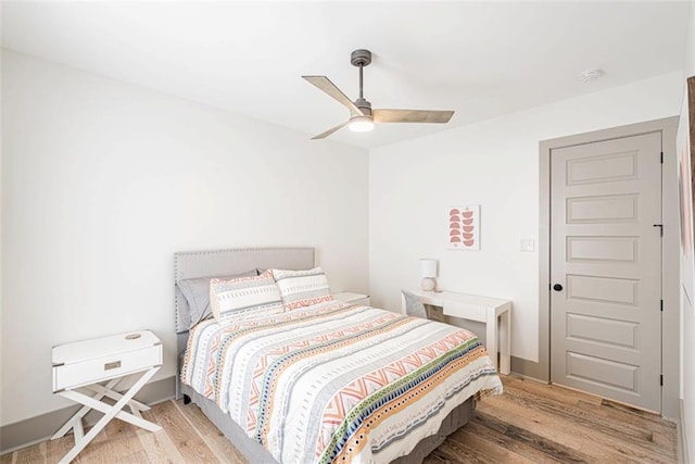 41820 S Genois St, New Orleans, LA 70119 - bedroom with light wood finished floors and ceiling fan