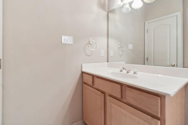 bathroom featuring vanity and baseboards