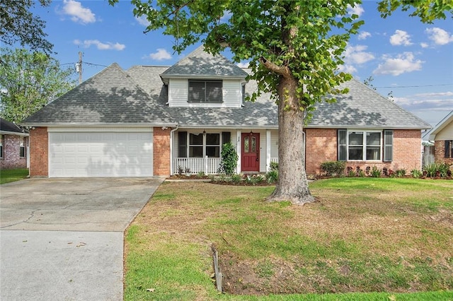 traditional home with a front yard, a shingled roof, brick siding, and a garage