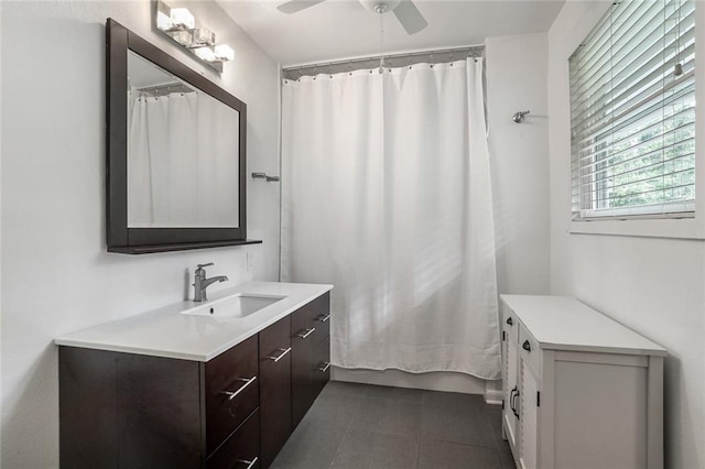 full bath featuring vanity, tile patterned floors, ceiling fan, and curtained shower