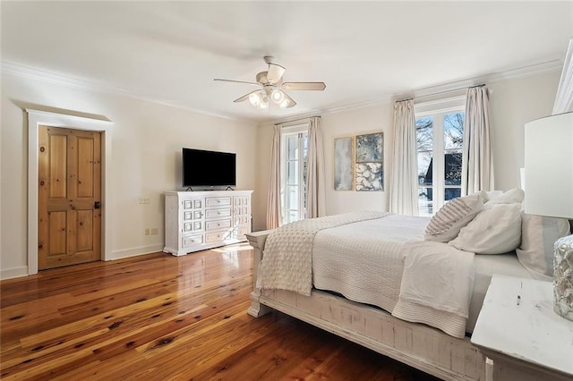 bedroom with crown molding, ceiling fan, access to exterior, and hardwood / wood-style floors